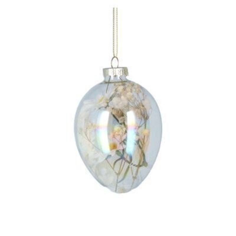 Glass egg shaped hanging decoration with white and yellow dried flowers inside. A lovely addition to your home for Spring and the perfect gift for mothers day. By Gisela Graham.